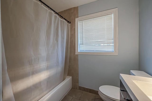 full bathroom featuring toilet, tile patterned flooring, vanity, and shower / bath combination with curtain