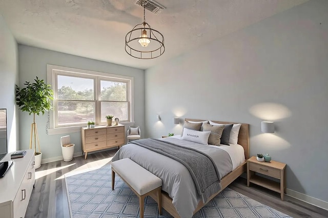 bedroom with light hardwood / wood-style floors