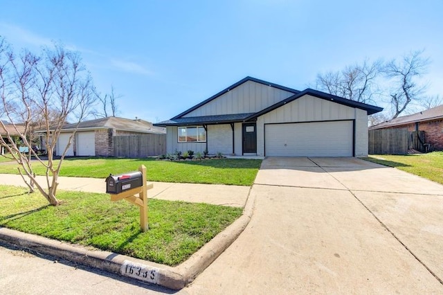 ranch-style home with a garage and a front yard