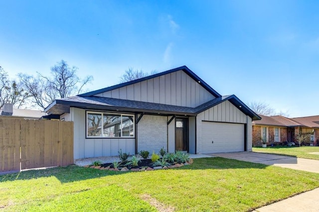 view of front facade with a front yard and a garage