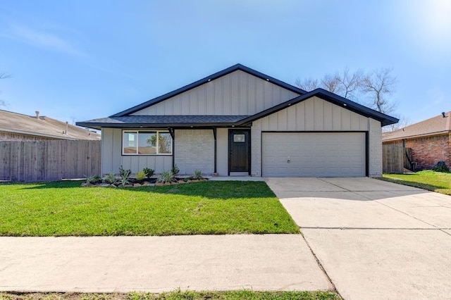 single story home featuring a garage and a front yard