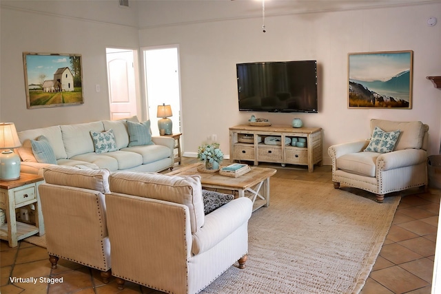 living room with tile patterned floors