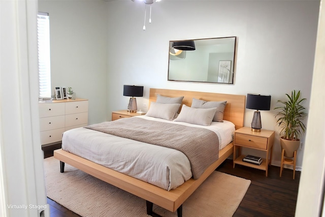 bedroom featuring dark wood-type flooring