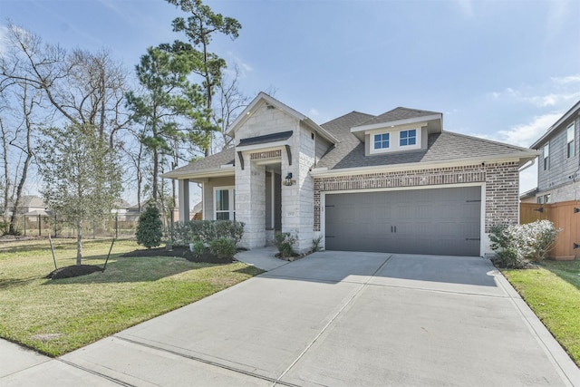 view of front of home featuring a front lawn and a garage