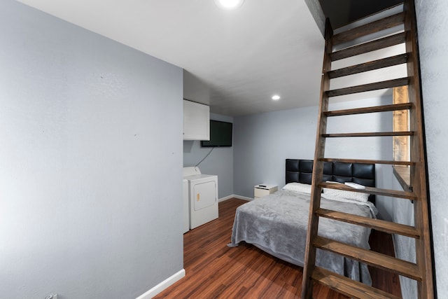 bedroom with dark hardwood / wood-style floors and washing machine and clothes dryer