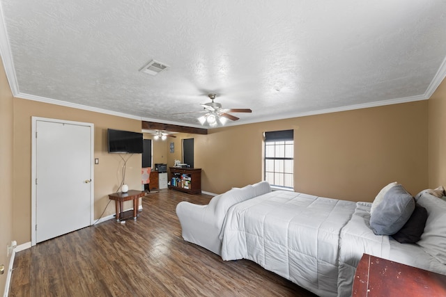 bedroom with dark hardwood / wood-style flooring, ornamental molding, a textured ceiling, and ceiling fan