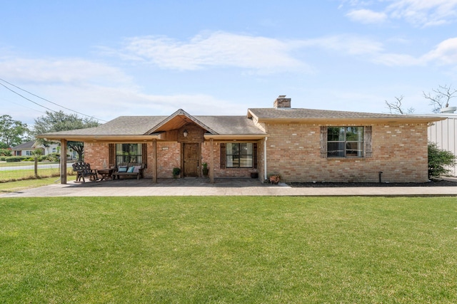 ranch-style home with a patio area and a front lawn