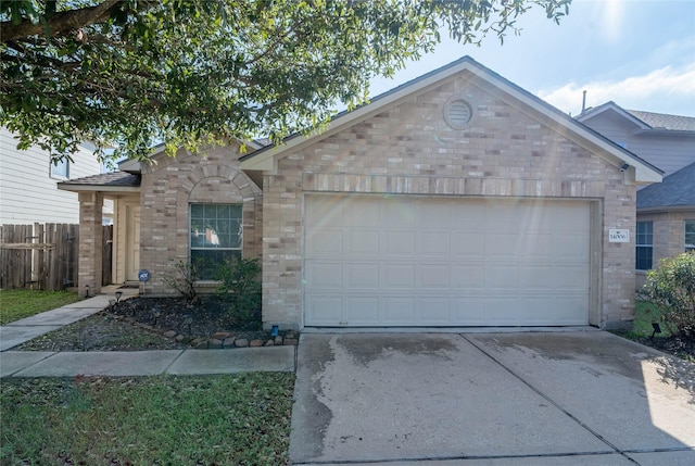 ranch-style home featuring a garage