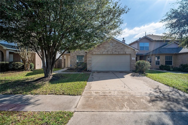 view of front of property featuring a garage and a front lawn