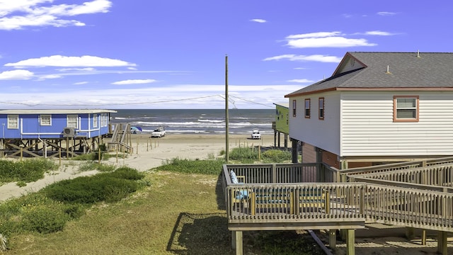 exterior space with a deck with water view