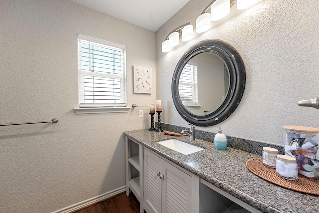 bathroom featuring vanity and hardwood / wood-style floors