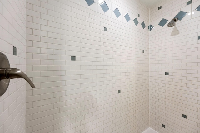 bathroom with a tile shower