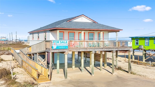 114 Coral Ct, Surfside Beach, TX 77541 - view of front of home with roof with shingles