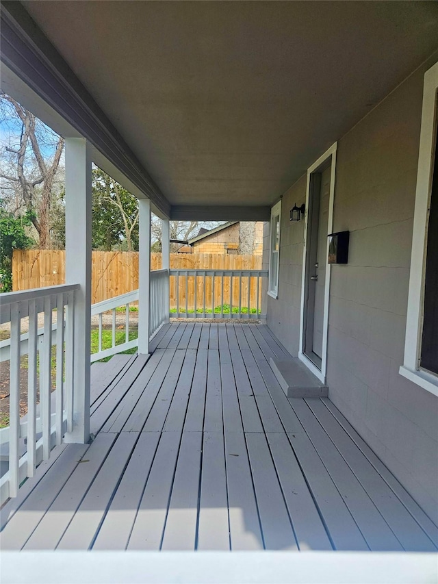 wooden terrace featuring covered porch