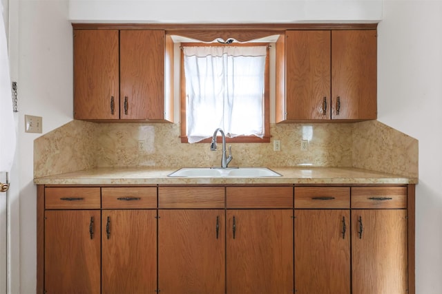 kitchen featuring sink and decorative backsplash