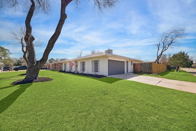 exterior space featuring a garage and a lawn