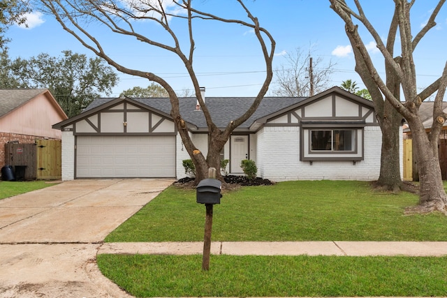 tudor home with concrete driveway, brick siding, a front lawn, and an attached garage