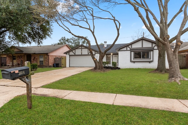 view of front of home with a garage and a front yard