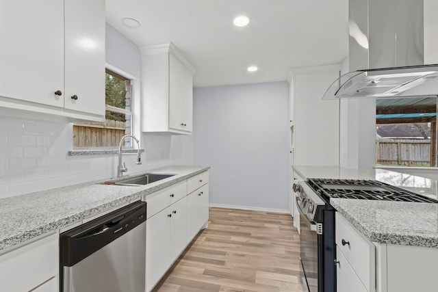 kitchen featuring white cabinets, island range hood, stainless steel appliances, and sink