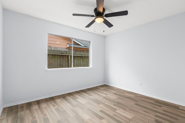 unfurnished room with light wood-type flooring and ceiling fan