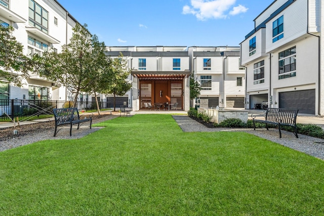 view of home's community with a yard and a pergola