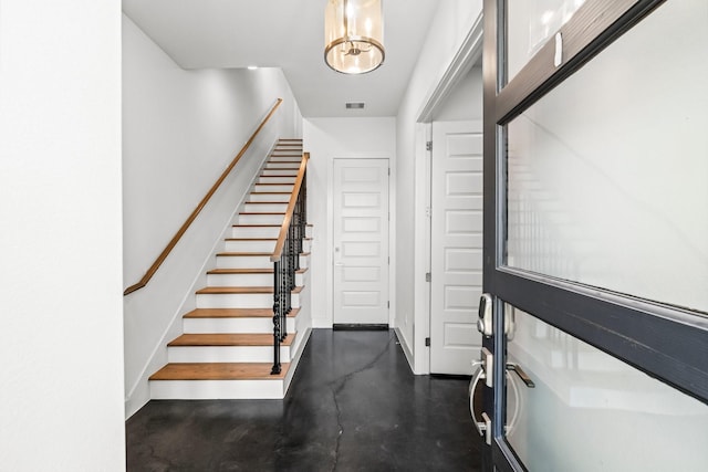 stairway with concrete floors