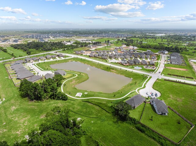 31911 Splendor Dr, Fulshear, TX 77441 - aerial view of property and surrounding area with a nearby body of water and nearby suburban area