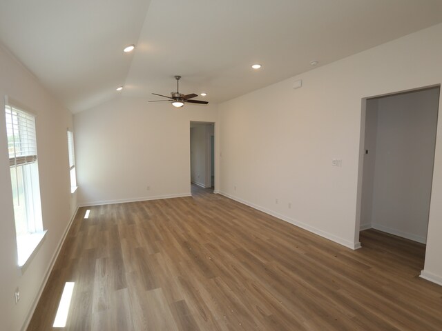 31911 Splendor Dr, Fulshear, TX 77441 - empty room featuring a ceiling fan, wood finished floors, lofted ceiling, baseboards, and recessed lighting