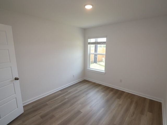 31911 Splendor Dr, Fulshear, TX 77441 - spare room with wood finished floors and baseboards