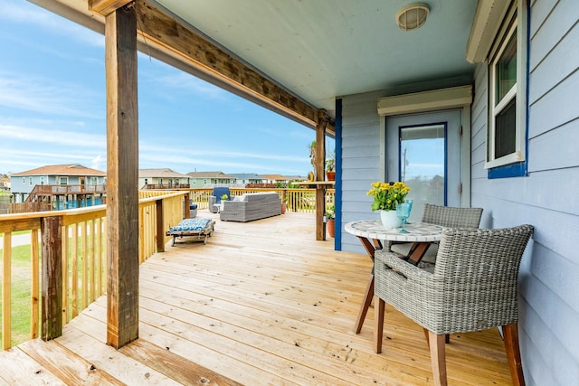 wooden deck with outdoor lounge area