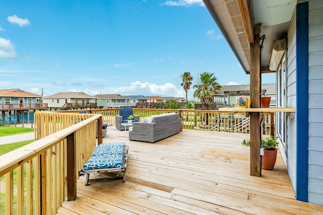 wooden deck featuring an outdoor hangout area