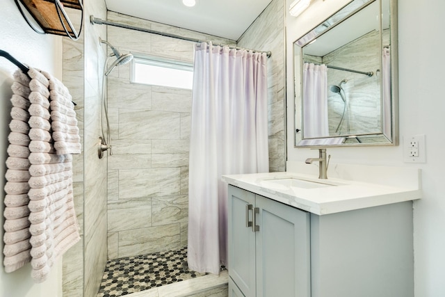 bathroom featuring vanity and a shower with curtain