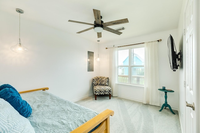 carpeted bedroom featuring electric panel and ceiling fan