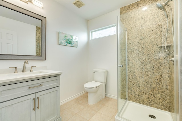 bathroom with vanity, a shower with door, toilet, and tile patterned floors