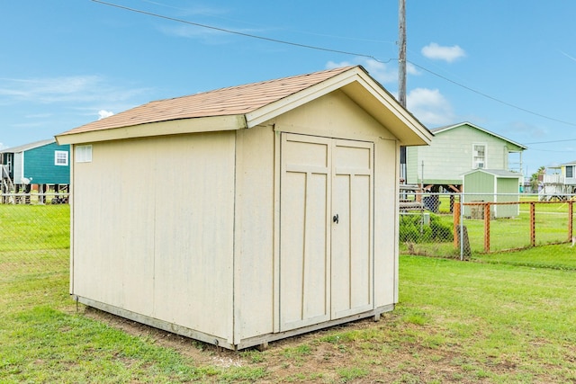 view of outdoor structure featuring a yard