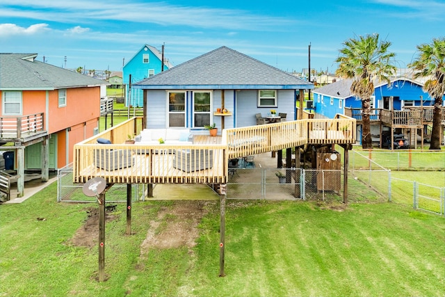 back of house featuring a yard and a deck