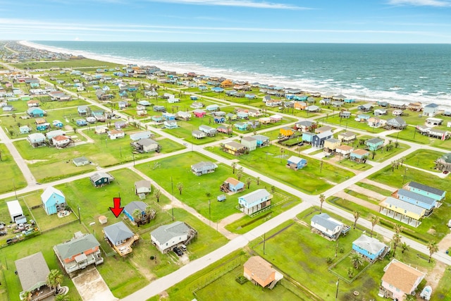 aerial view featuring a water view and a beach view