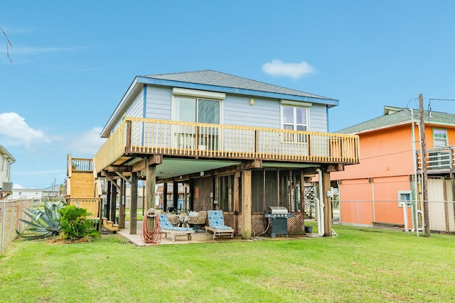 back of house with a patio area, a yard, and a wooden deck