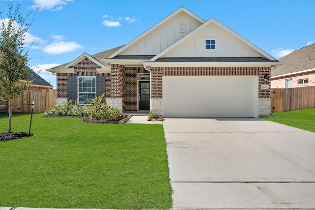 view of front of home featuring a front yard and a garage