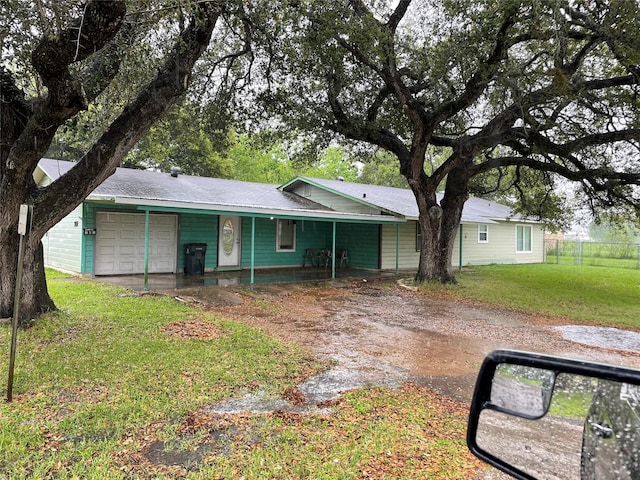 single story home with a front lawn and a garage