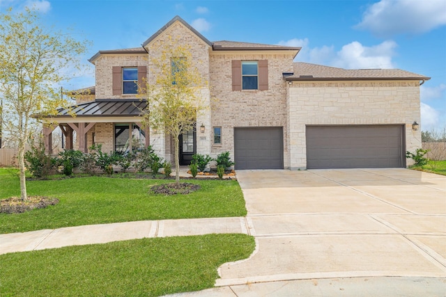 view of front of property featuring a front lawn and a garage