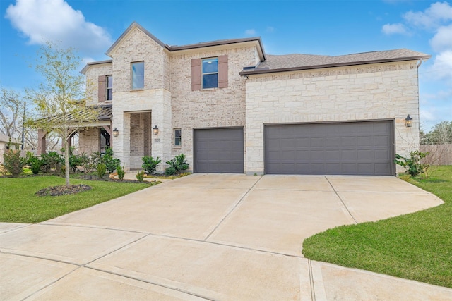 view of front of property featuring a front lawn and a garage