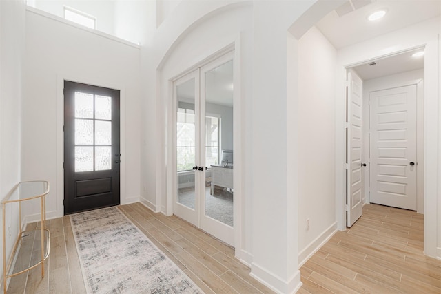 foyer entrance featuring french doors and a wealth of natural light