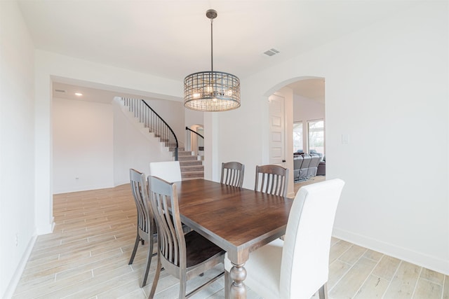 dining space featuring an inviting chandelier