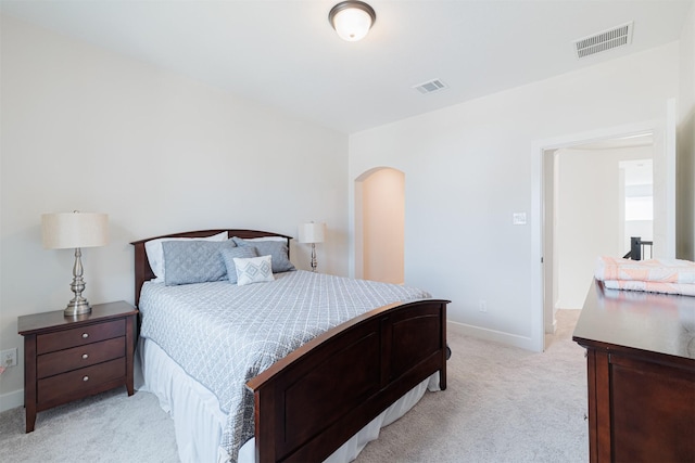 bedroom with light carpet