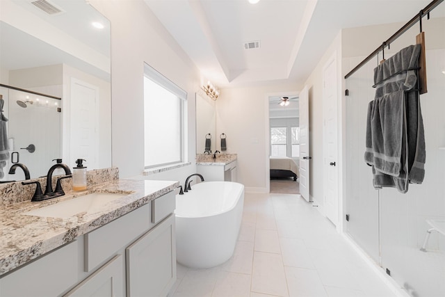 bathroom with tile patterned floors, independent shower and bath, vanity, and ceiling fan