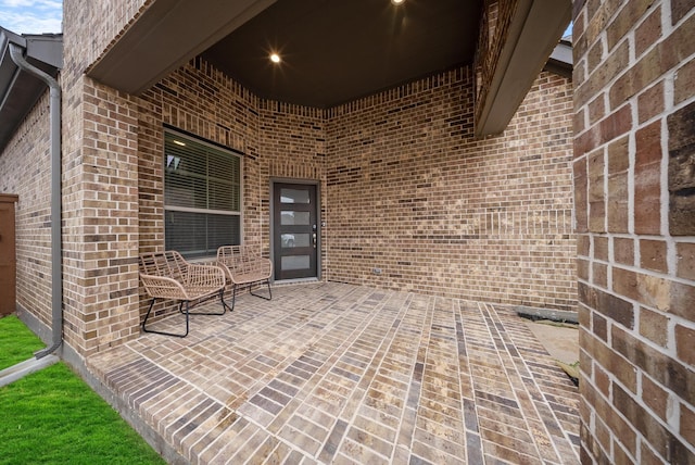 property entrance featuring a patio area