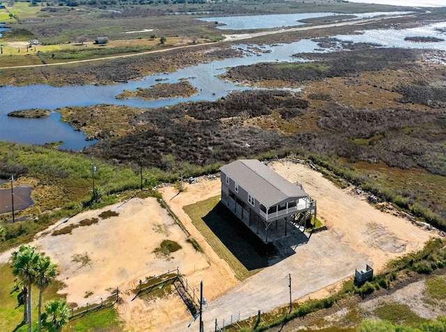 birds eye view of property with a rural view and a water view