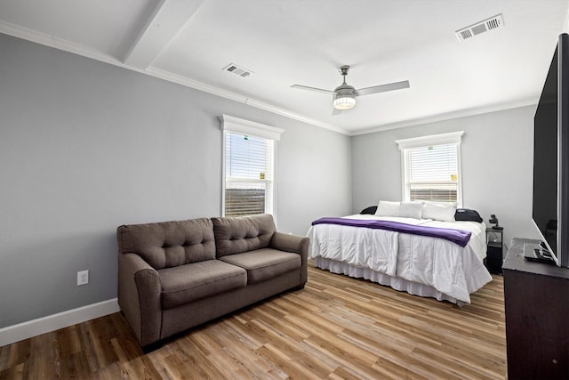 1623 Bay Meadows St, Galveston, TX 77554 - bedroom featuring crown molding, light wood-style floors, visible vents, and baseboards