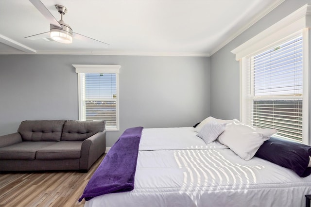 1623 Bay Meadows St, Galveston, TX 77554 - bedroom with multiple windows, wood finished floors, a ceiling fan, and ornamental molding
